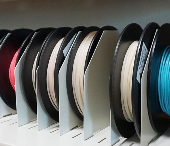 Spools of color material for 3D printing.