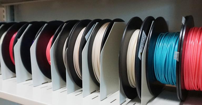 Spools of color material for 3D printing.