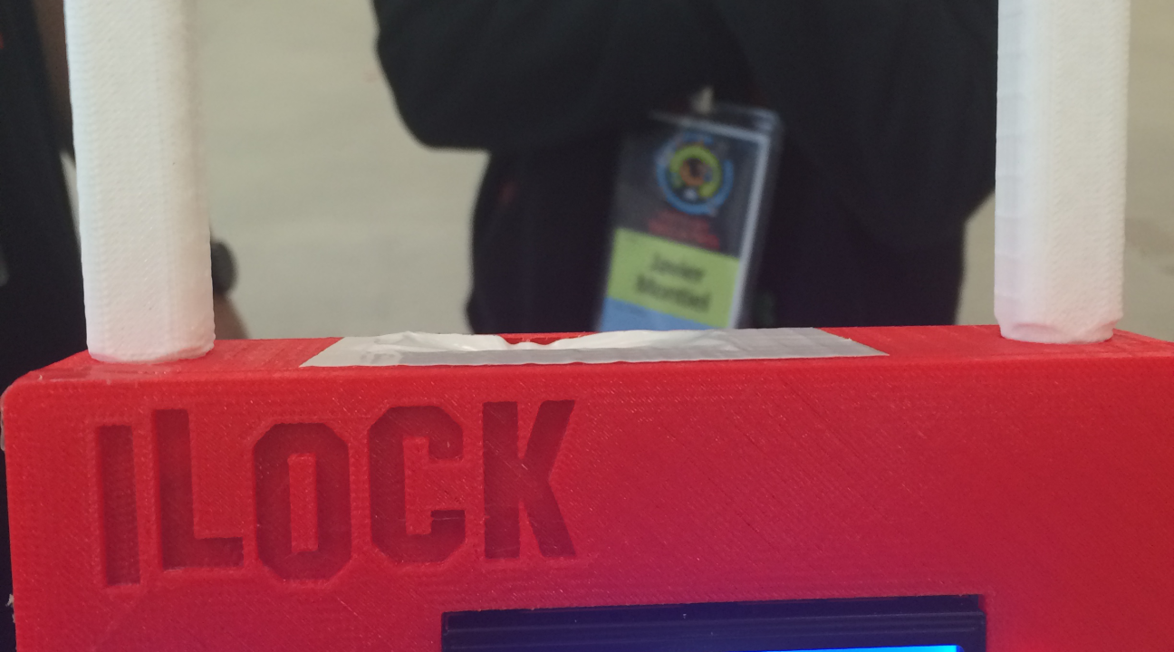 Plastic shaped like a large log, with the letters "ILOCK".  There is a electronic interface withthe words Ready .. press scanner.
