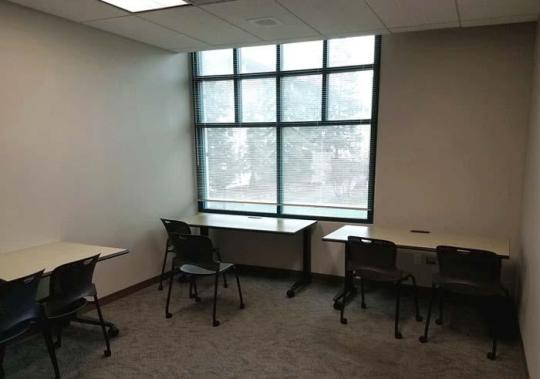 3 tables, each with a computer and VR equiptment.