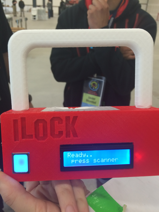 Plastic shaped like a large log, with the letters "ILOCK".  There is a electronic interface withthe words Ready .. press scanner.