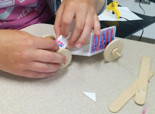 Toy car being built.